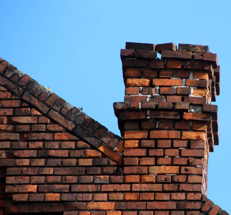 Signs Your Bonita Home Needs a Chimney Inspection Damaged chimney on an Bonita home showing cracks and missing mortar